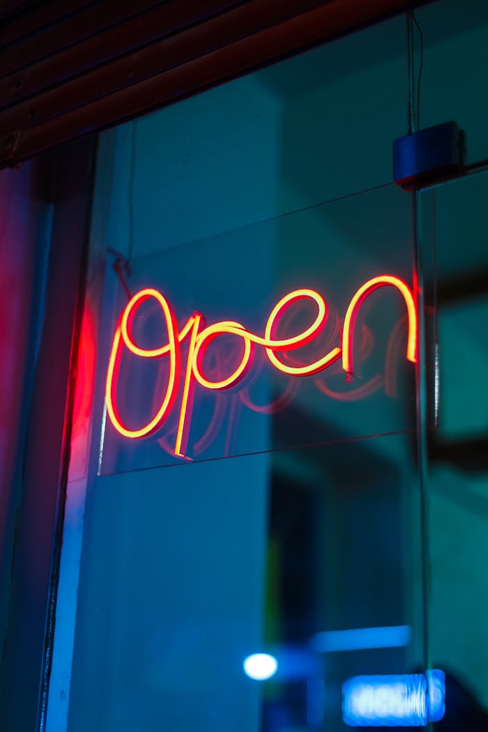 creative-03 A glowing neon open sign brightens up the night with its vivid red hue.